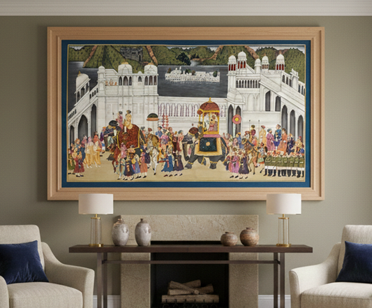 A large, colorful painting depicts a royal procession in Rajasthan, featuring elegantly dressed figures, an ornate elephant, and a grand palace backdrop.