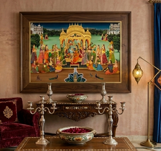 A beautifully framed Pichwai painting depicting the Raasleela of Radha and Krishna, surrounded by elegantly dressed figures in a lush, vibrant setting.