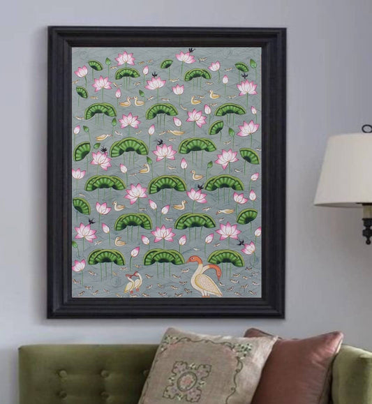 Hand-painted Pichwai painting with lotus flowers, birds, and aquatic motifs in a black frame